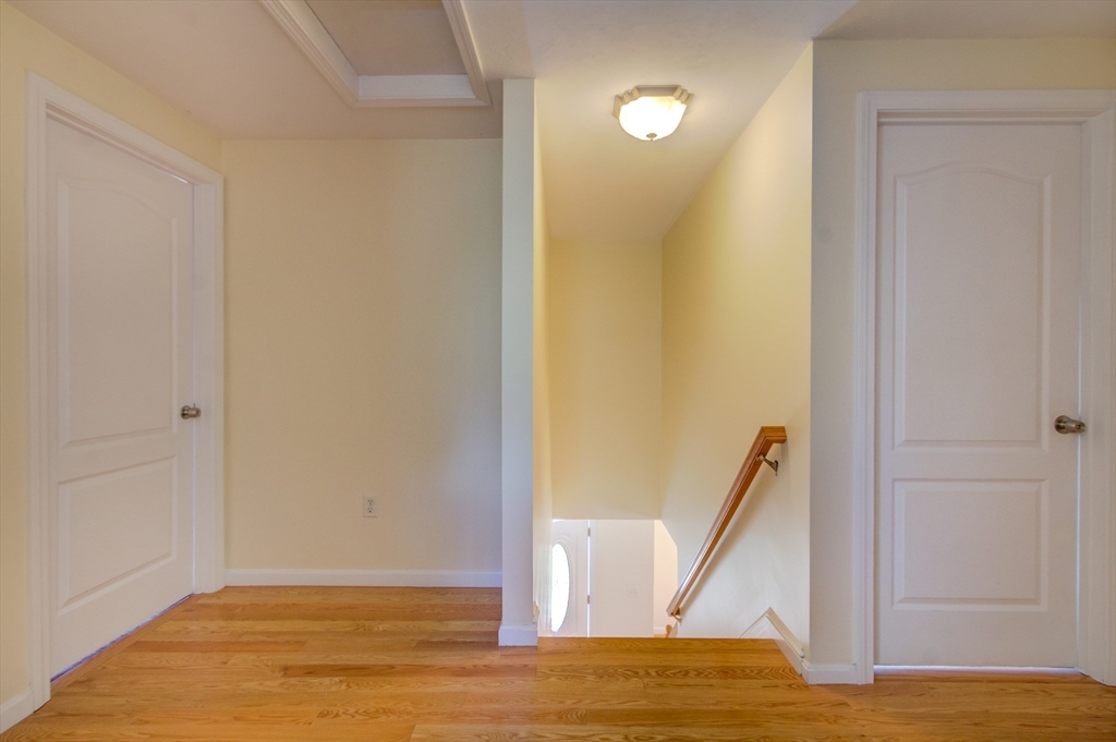 17 Lynne Road Wareham, MA 02571 - Photo 35 of 42 a view of a hallway with wooden floor and staircase
