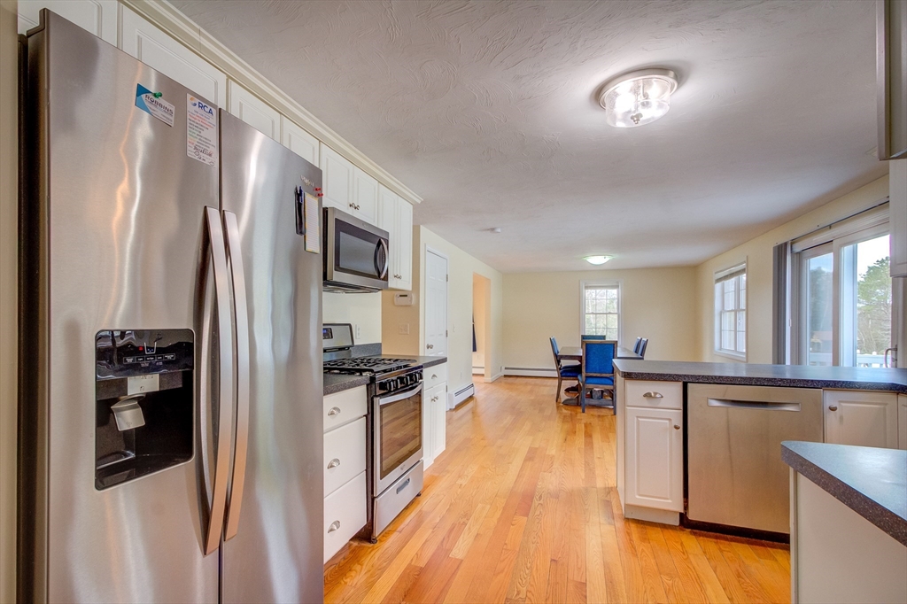 17 Lynne Road Wareham, MA 02571 - Photo 6 of 42 a kitchen with stainless steel appliances granite countertop a refrigerator stove top oven and sink