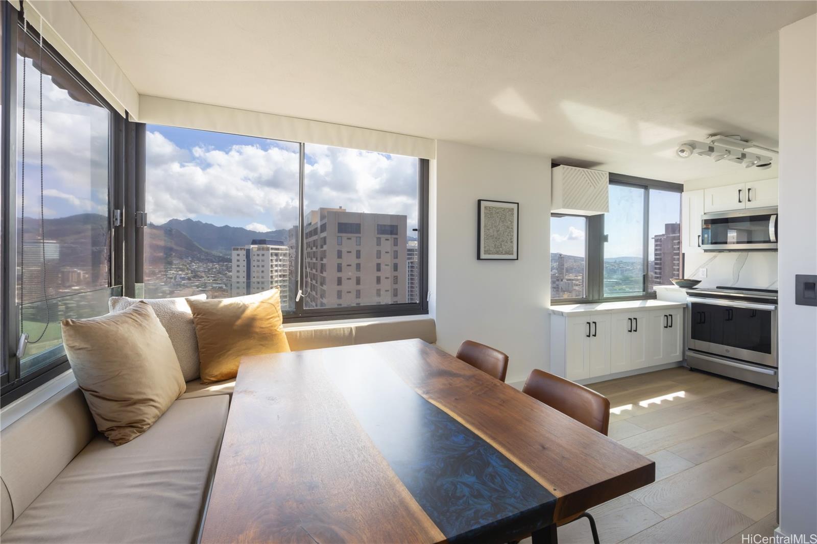343 Hobron Lane, Unit 3901 Honolulu, HI 96815 - Photo 12 of 25 a living room with furniture and a large window