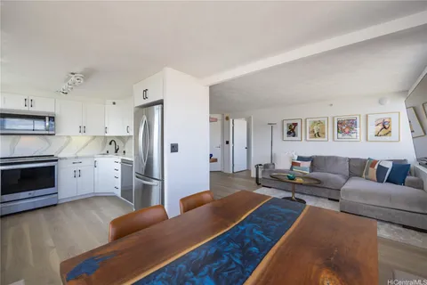 a living room with furniture and a stove top oven
