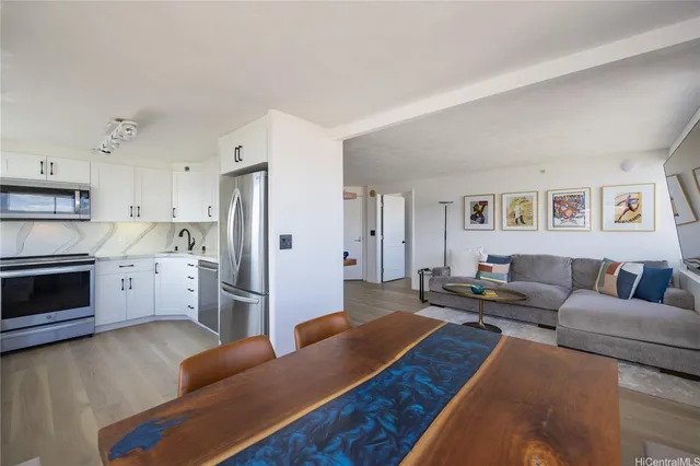 a living room with furniture and a stove top oven
