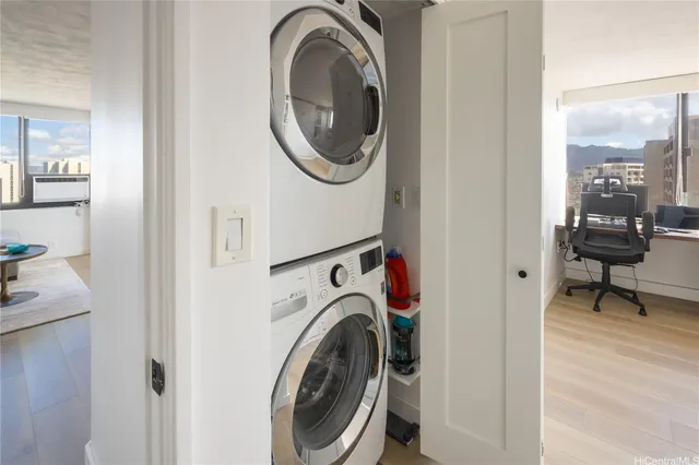 a view of a hallway with washer and dryer