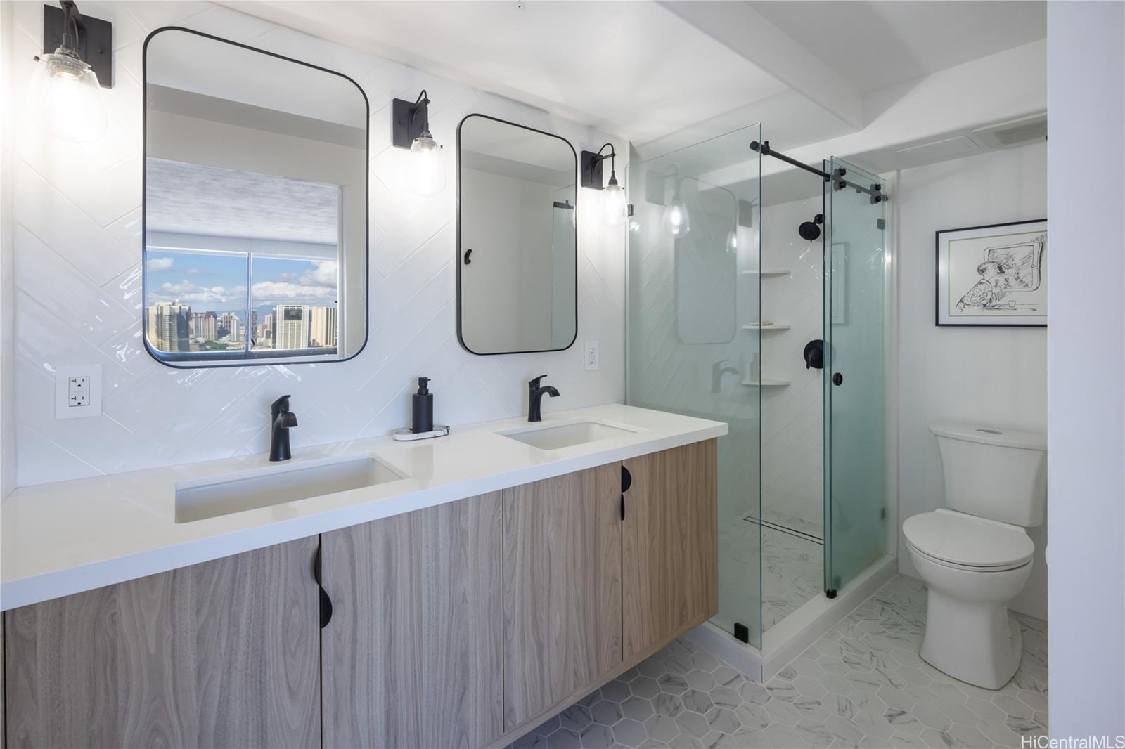 343 Hobron Lane, Unit 3901 Honolulu, HI 96815 - Photo 6 of 25 a bathroom with a double vanity sink toilet and a mirror
