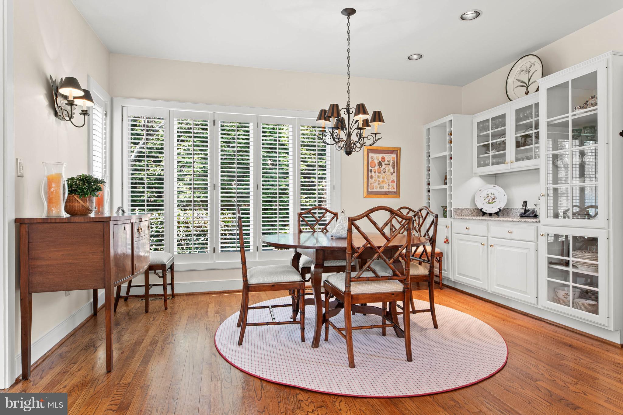 1244 Denbigh Lane Wayne, PA 19087 - Photo 10 of 38 a dining room with furniture a chandelier and wooden floor