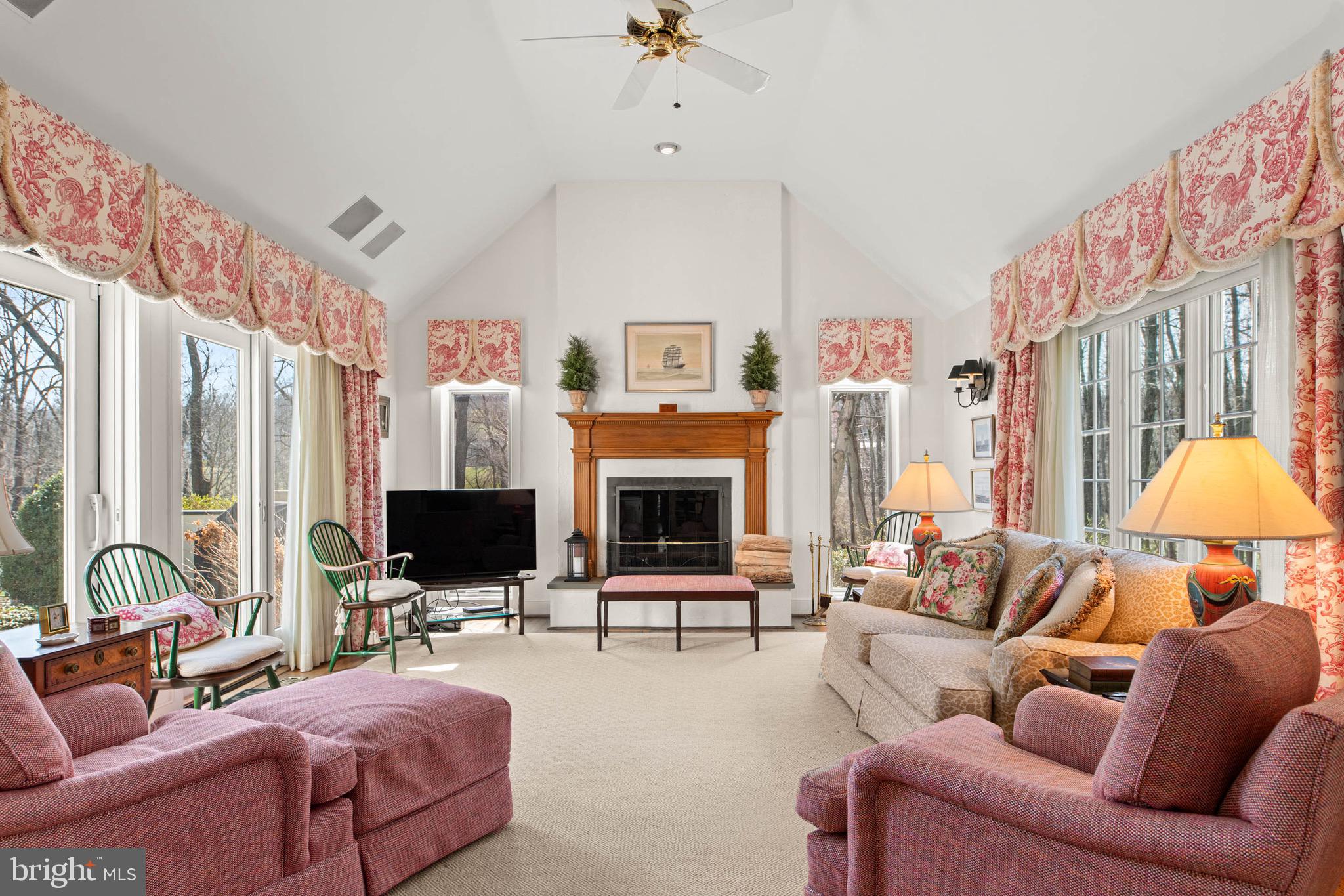 1244 Denbigh Lane Wayne, PA 19087 - Photo 12 of 38 a living room with furniture a fireplace and a large mirror