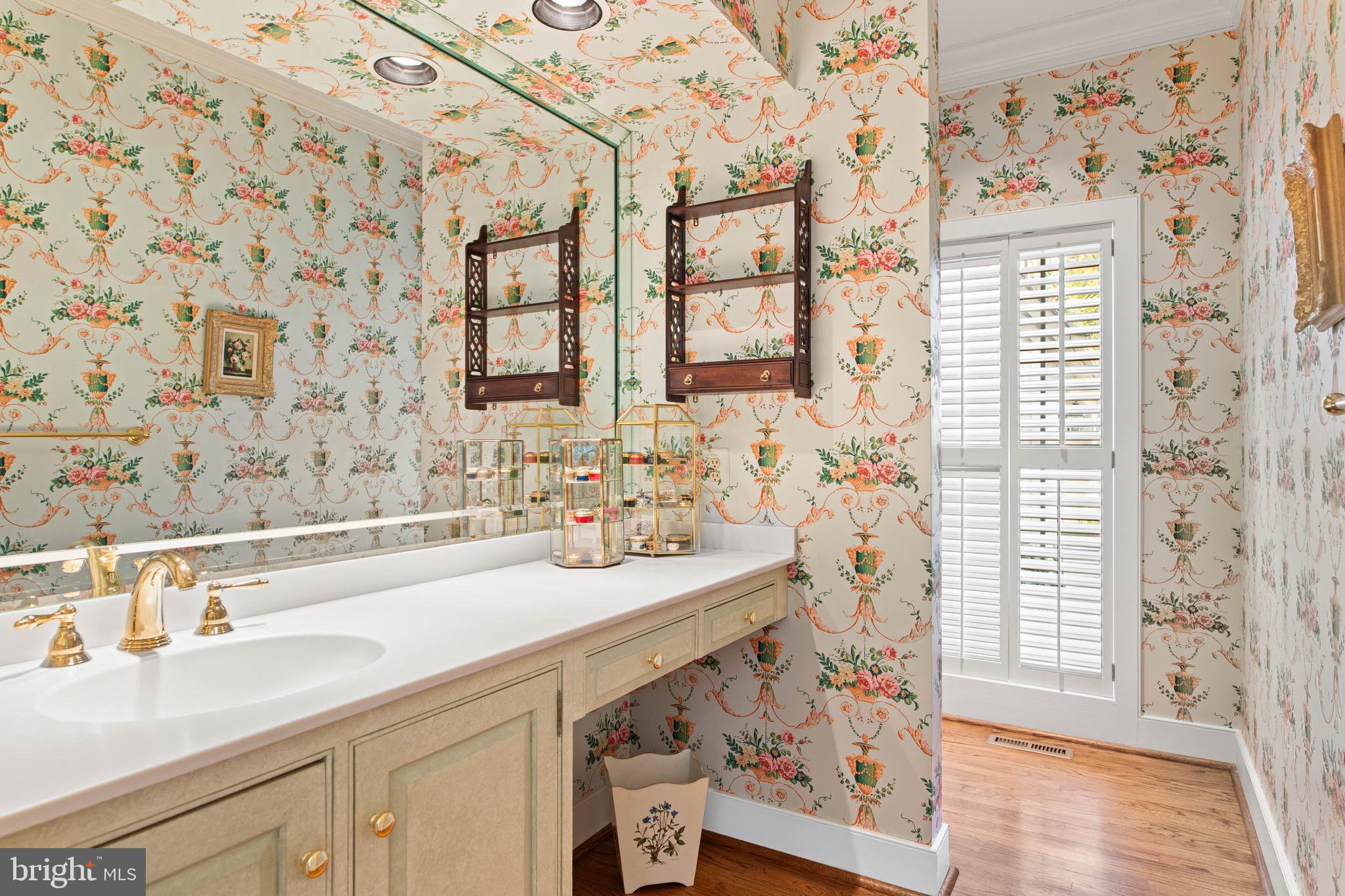 1244 Denbigh Lane Wayne, PA 19087 - Photo 13 of 38 a bathroom with a sink a mirror and a shower