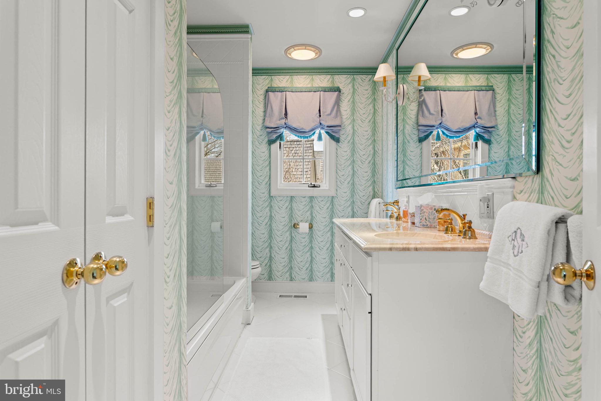 1244 Denbigh Lane Wayne, PA 19087 - Photo 19 of 38 a bathroom with a sink mirror toilet and shower