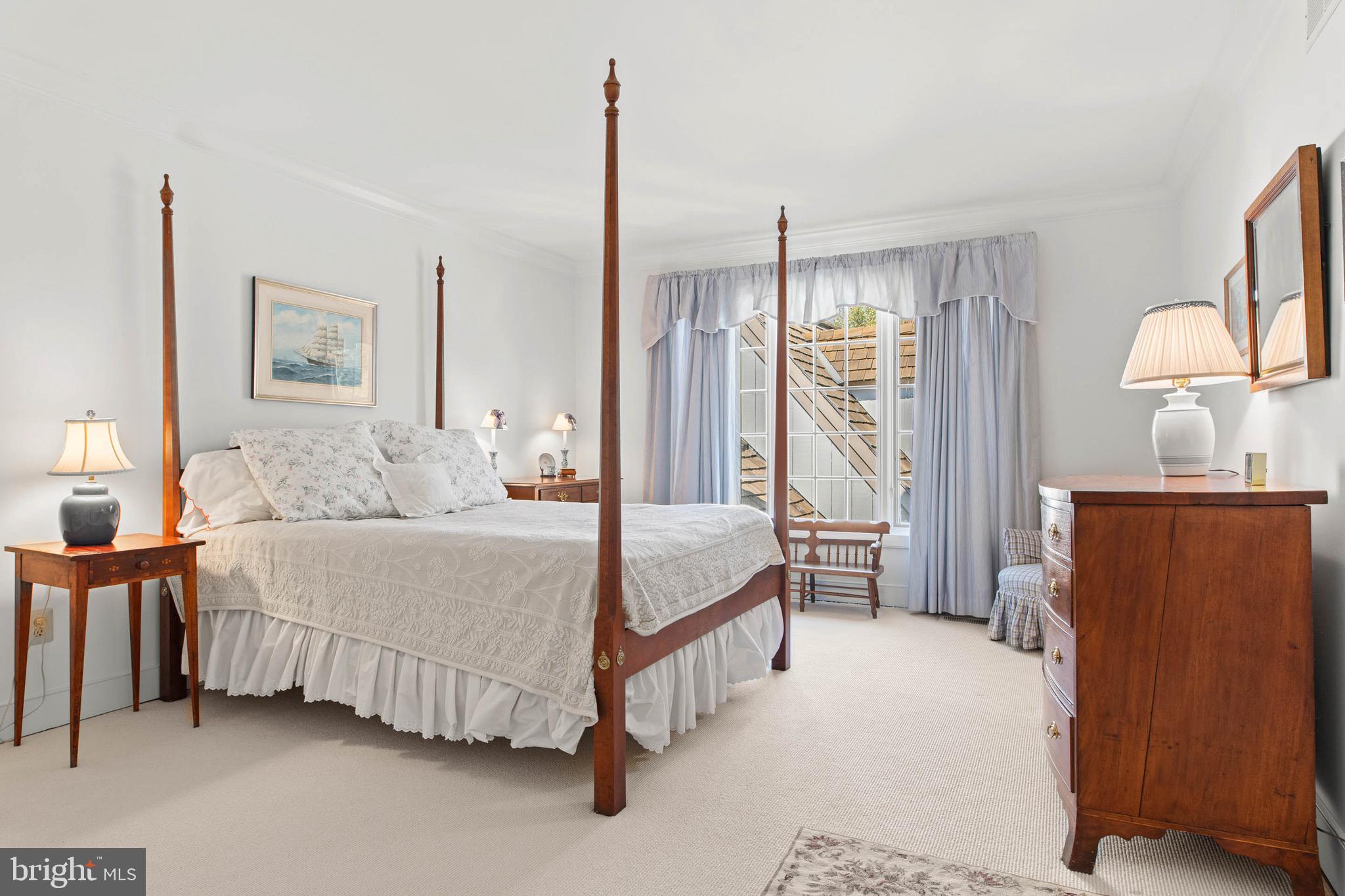 1244 Denbigh Lane Wayne, PA 19087 - Photo 27 of 38 a bedroom with a bed chandelier and a window