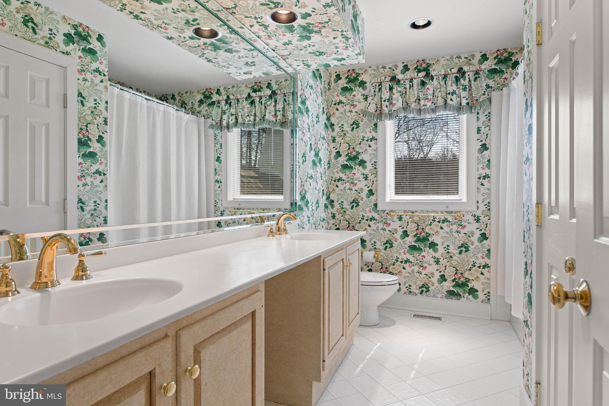 1244 Denbigh Lane Wayne, PA 19087 - Photo 28 of 38 a bathroom with a sink a toilet and shower