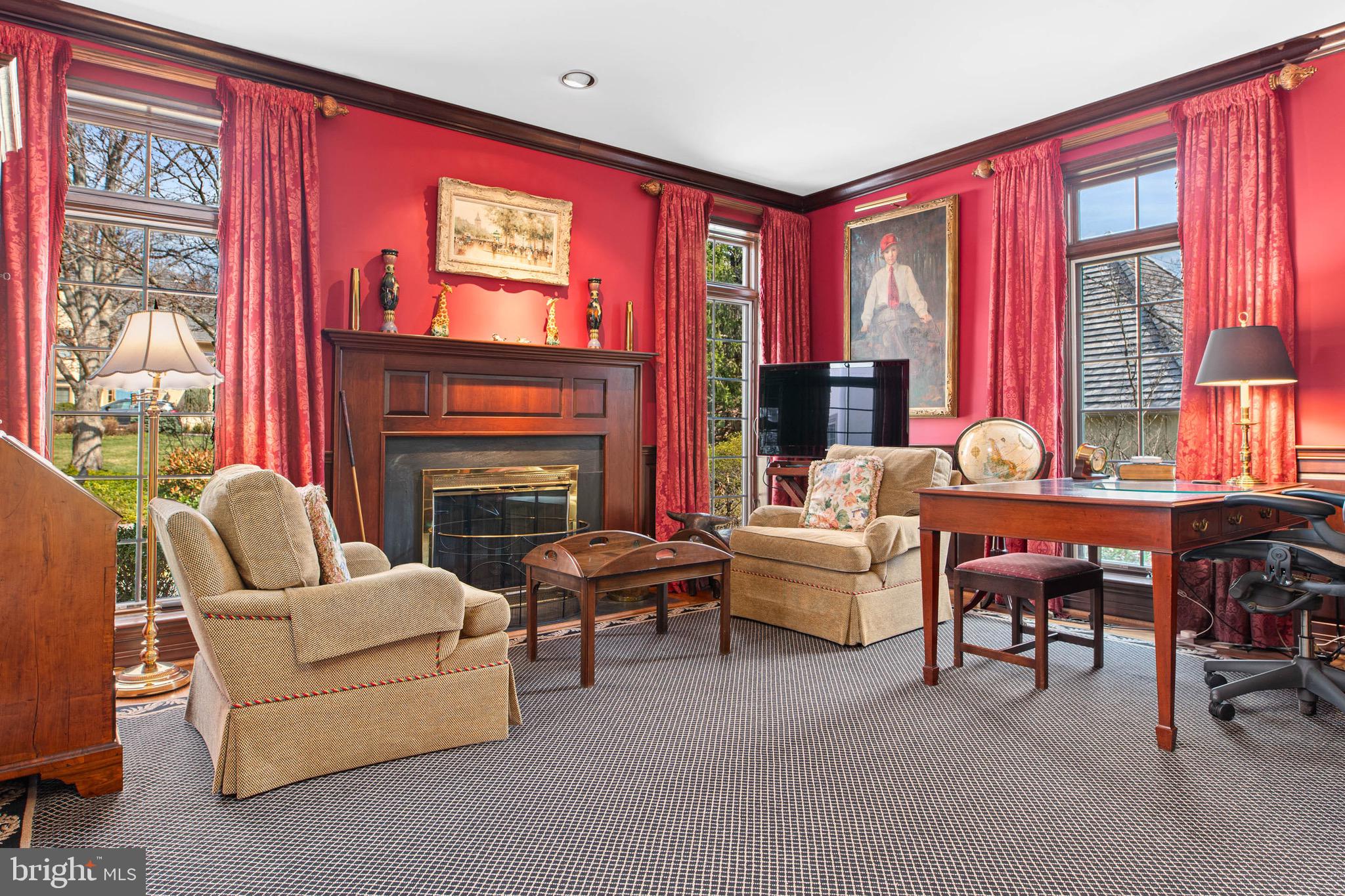 1244 Denbigh Lane Wayne, PA 19087 - Photo 6 of 38 a living room with furniture a fireplace and a large window