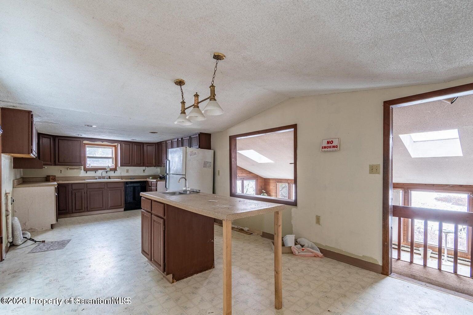 1777 Lamb Road Thompson, PA 18465 - Photo 10 of 31 a kitchen with sink cabinets and window