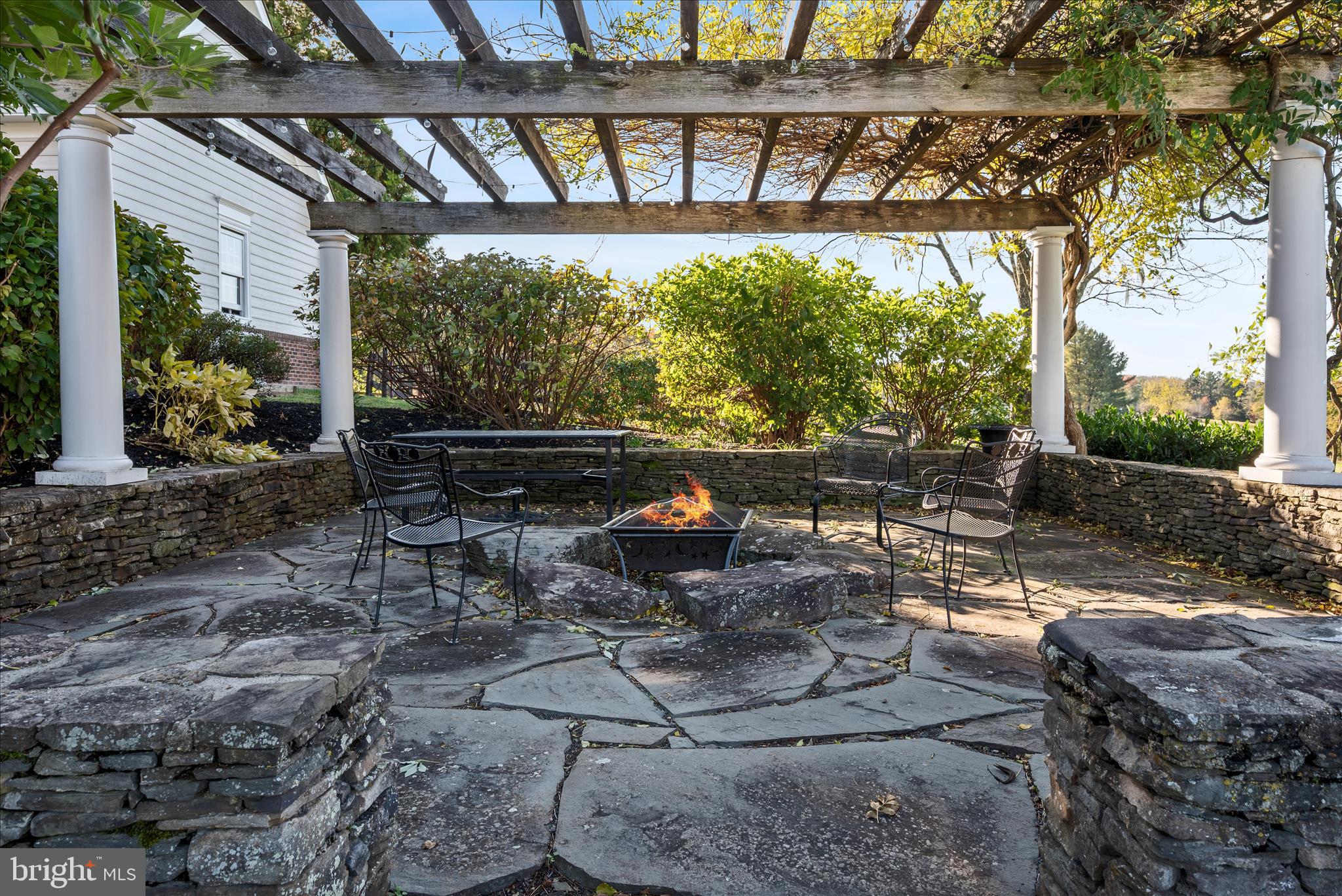 17635 Harmony Church Road Hamilton, VA 20158 - Photo 25 of 108 a view of a patio with table and chairs potted plants and large tree