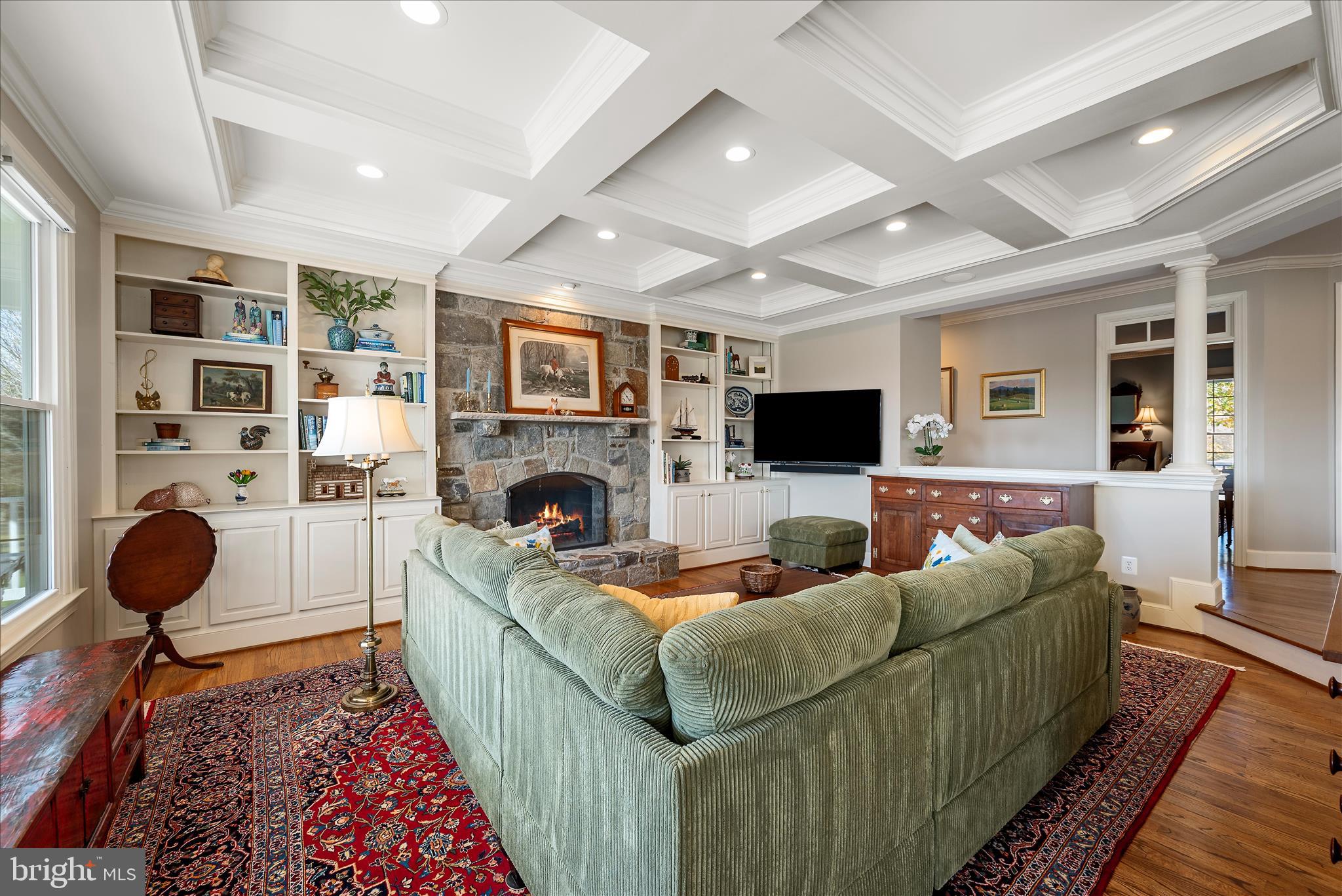 17635 Harmony Church Road Hamilton, VA 20158 - Photo 40 of 108 a living room with furniture a flat screen tv and a fireplace