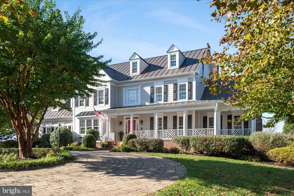 a view of a swimming pool with an outdoor space and seating area