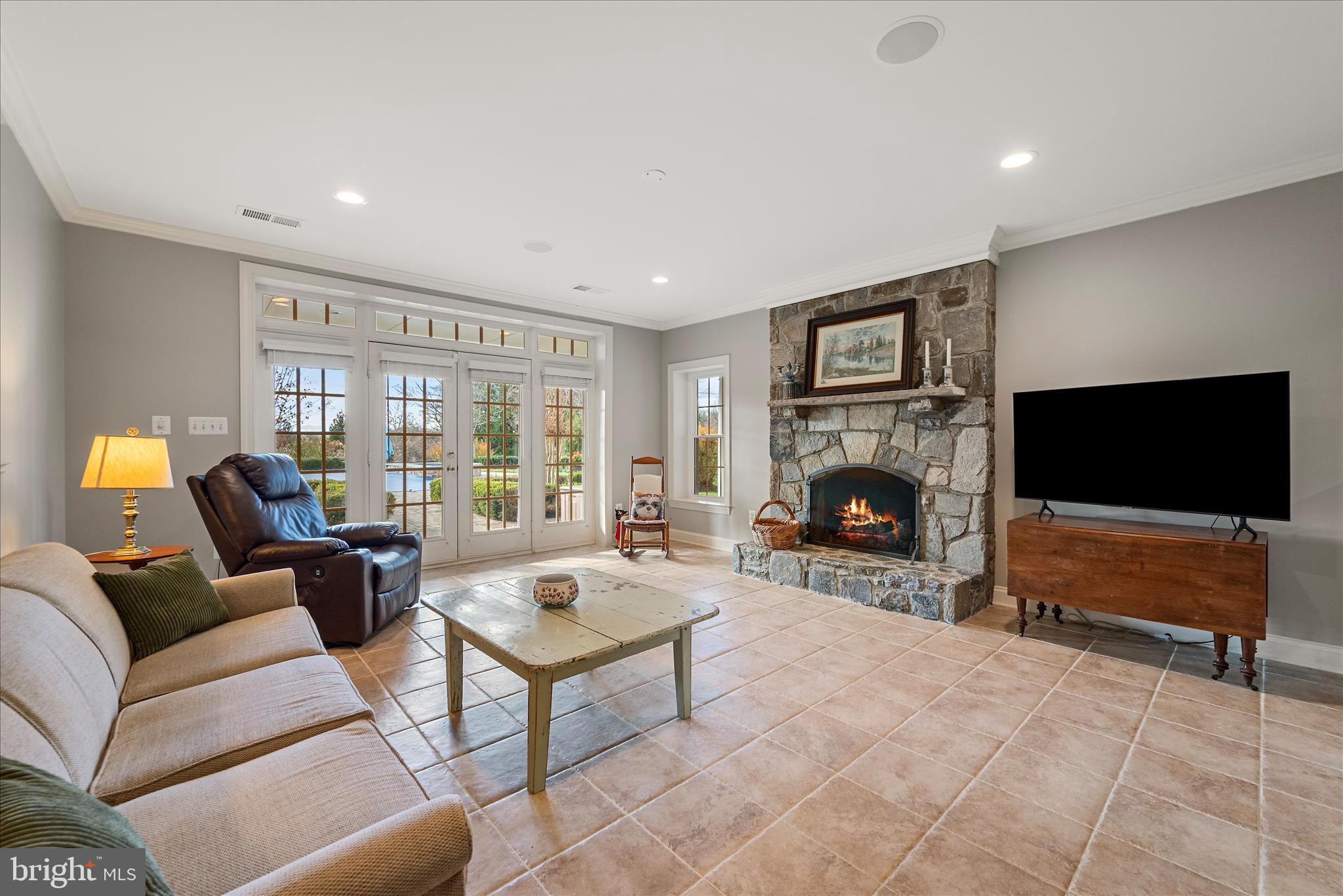 17635 Harmony Church Road Hamilton, VA 20158 - Photo 86 of 108 a living room with furniture a flat screen tv and a fireplace