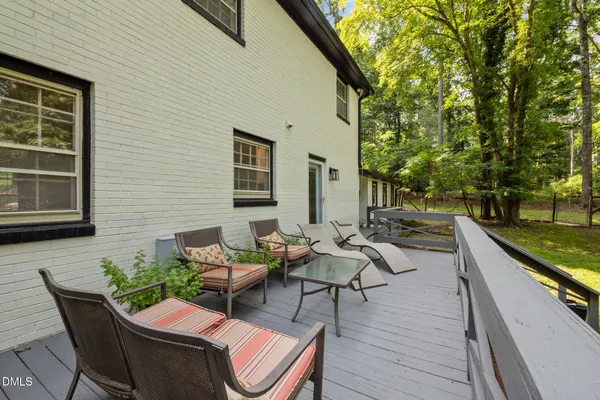 a backyard of a house with outdoor seating