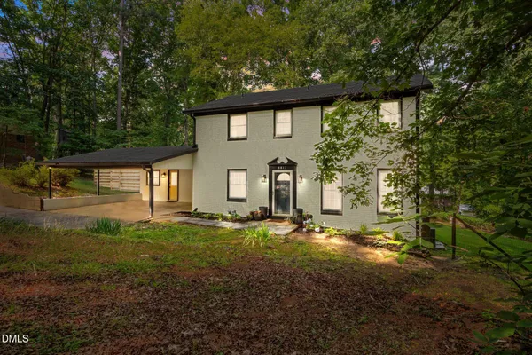 a view of a house with backyard tub and wooden fence