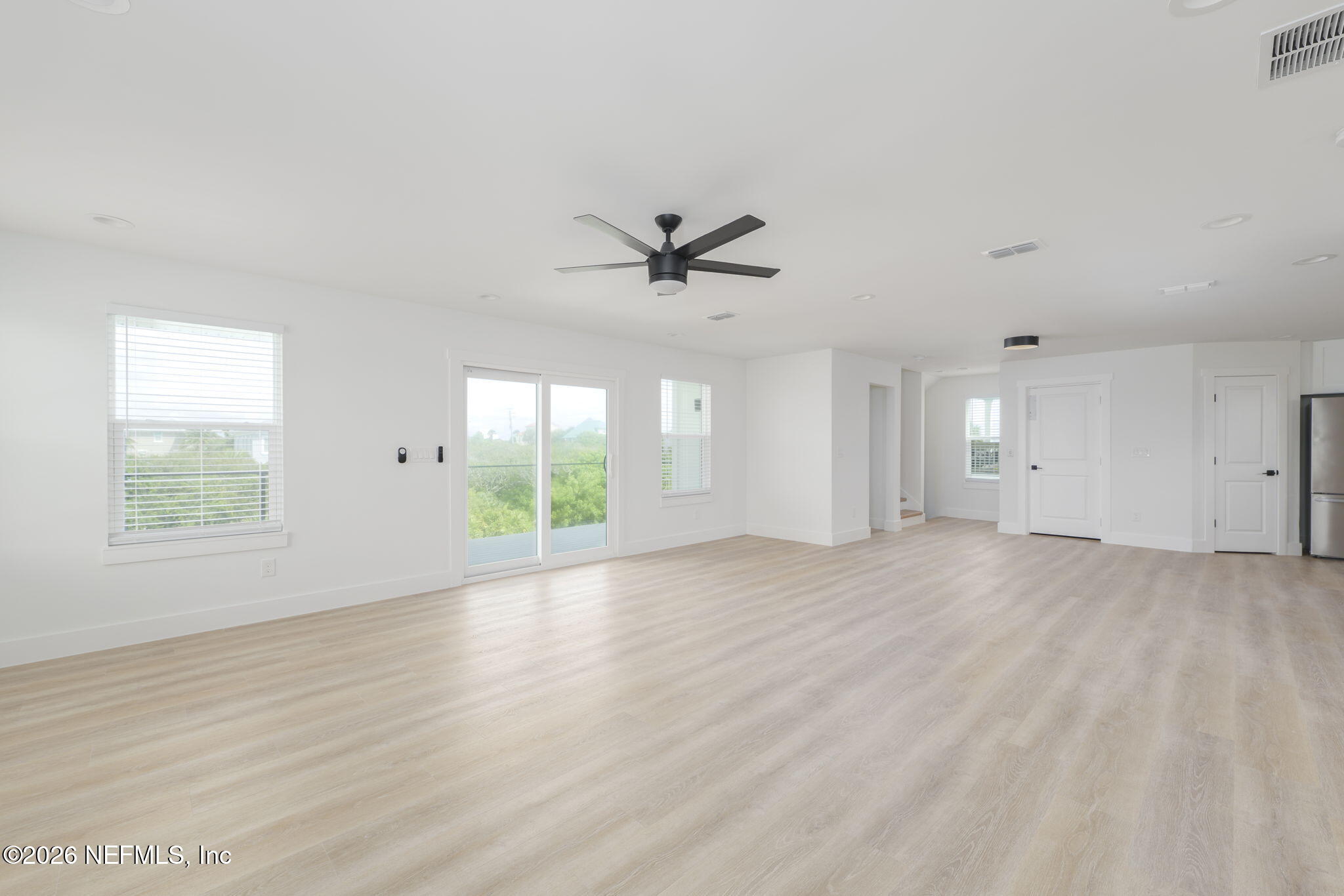 213 Twenty-First Street St. Augustine, FL 32084 - Photo 23 of 50 wooden floor in an empty room with a window