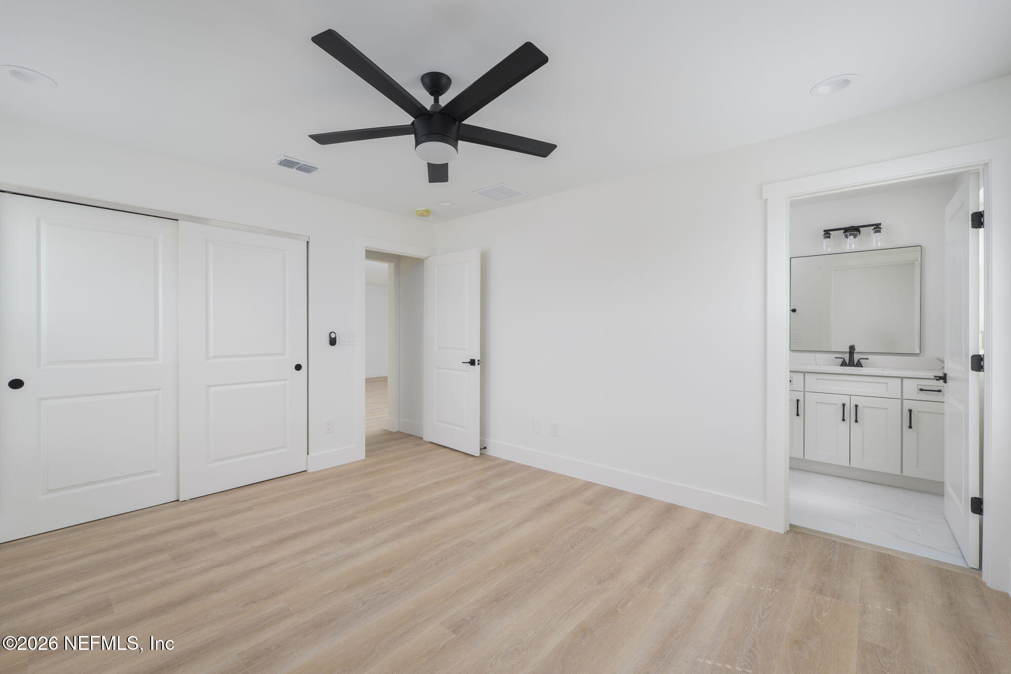 213 Twenty-First Street St. Augustine, FL 32084 - Photo 27 of 50 a view of a big room with wooden floor and a ceiling fan