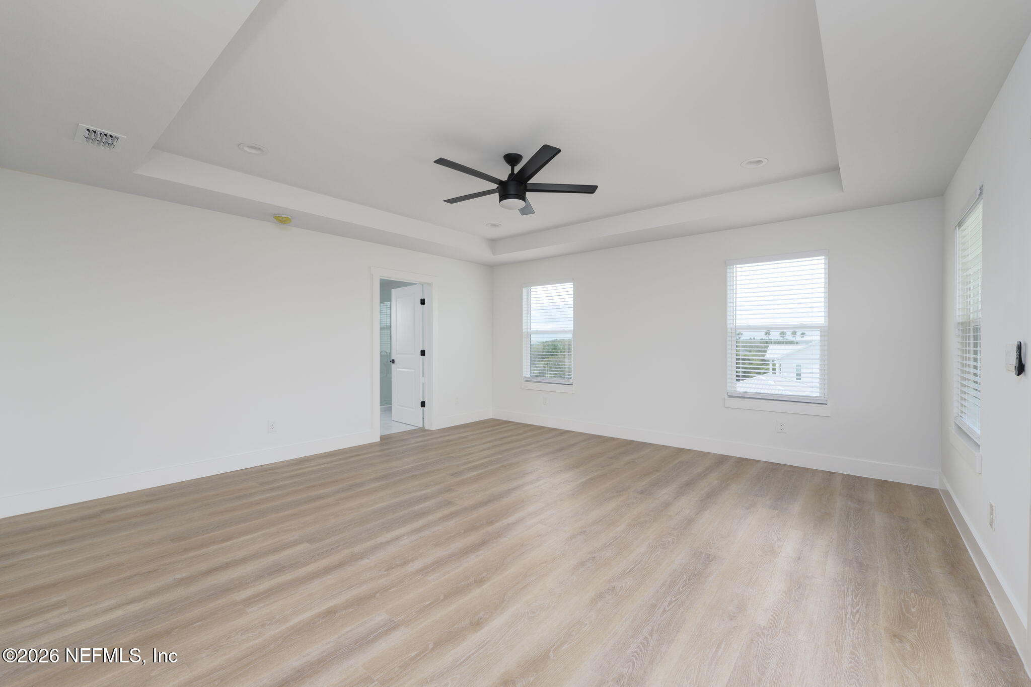 213 Twenty-First Street St. Augustine, FL 32084 - Photo 31 of 50 wooden floor in an empty room with a window