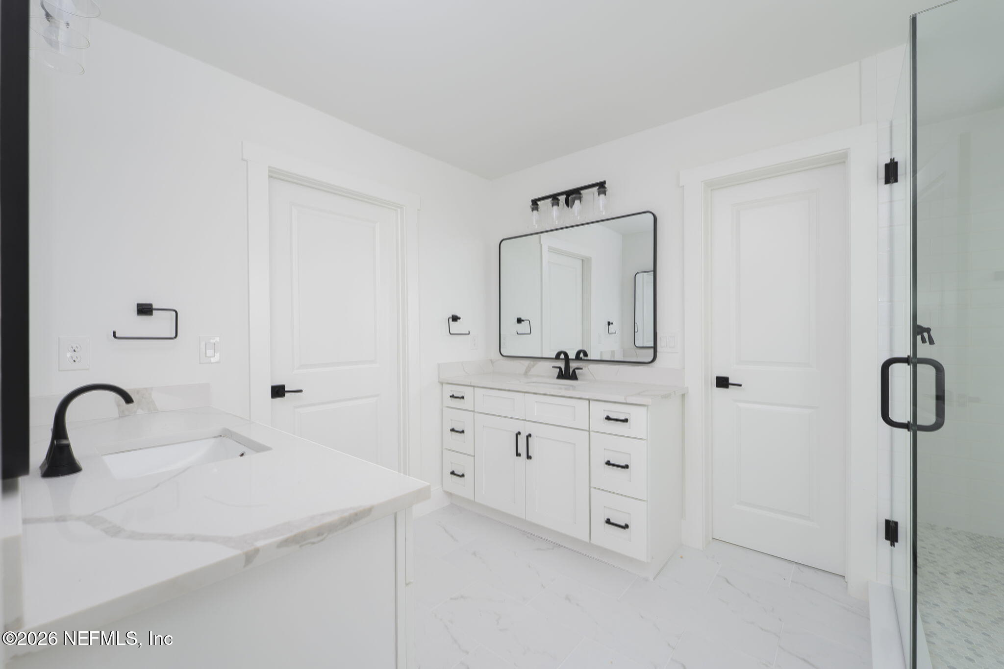 213 Twenty-First Street St. Augustine, FL 32084 - Photo 33 of 50 a bathroom with a double vanity sink mirror and