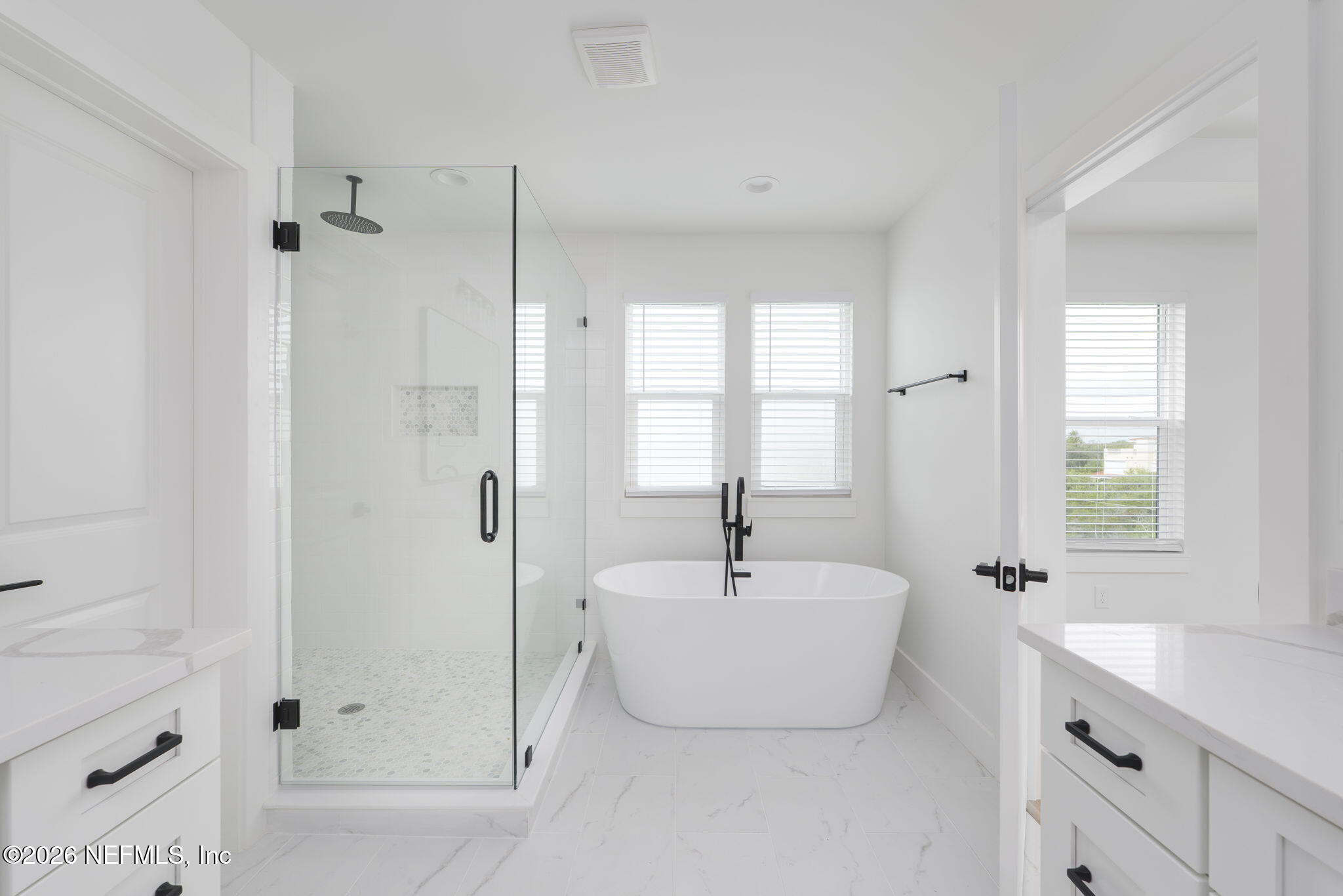 213 Twenty-First Street St. Augustine, FL 32084 - Photo 34 of 50 a bathroom with a bathtub and a sink