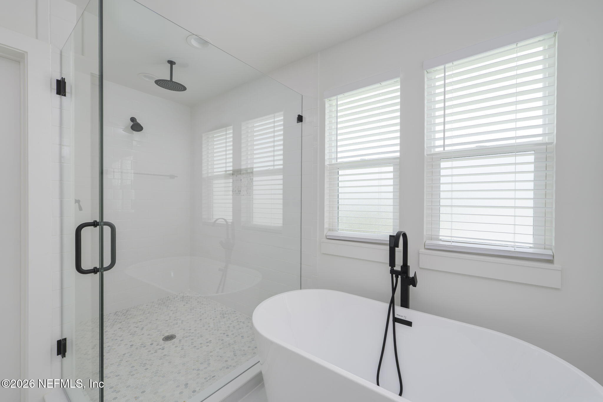 213 Twenty-First Street St. Augustine, FL 32084 - Photo 35 of 50 a bathroom with a bathtub and a shower