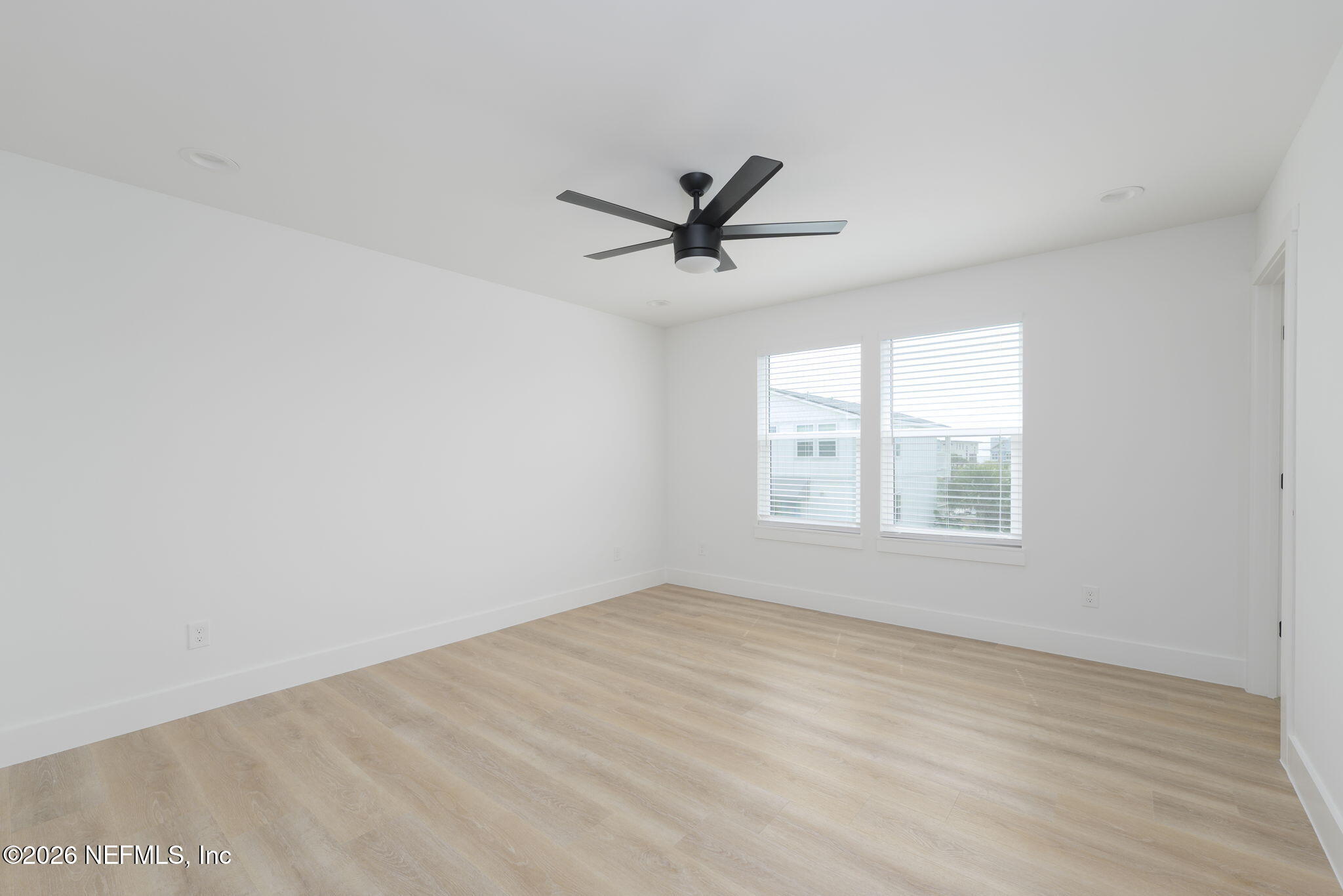 213 Twenty-First Street St. Augustine, FL 32084 - Photo 39 of 50 wooden floor in an empty room with a window