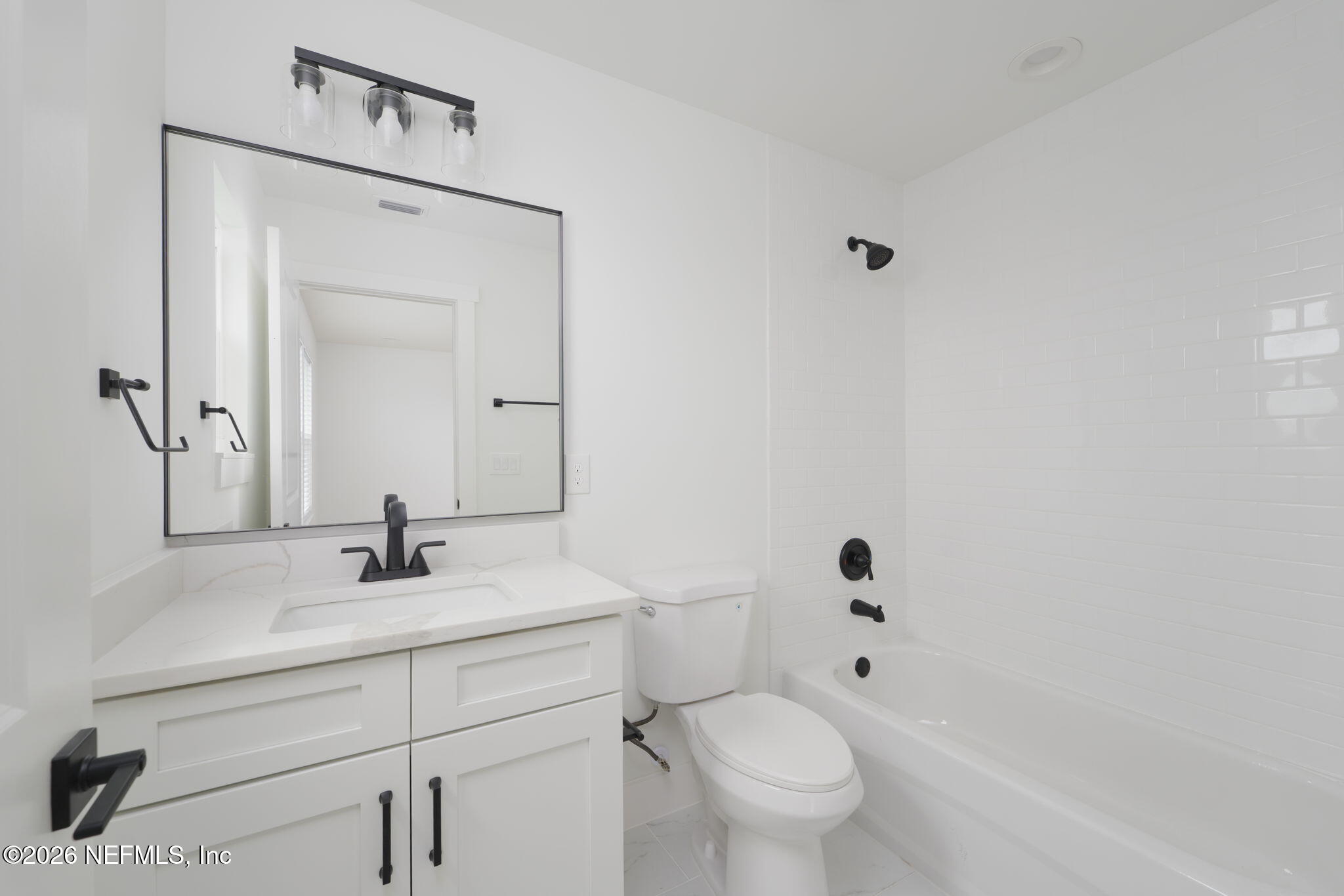 213 Twenty-First Street St. Augustine, FL 32084 - Photo 41 of 50 a bathroom with a sink a toilet and shower