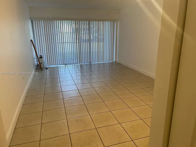 a view of a livingroom and window