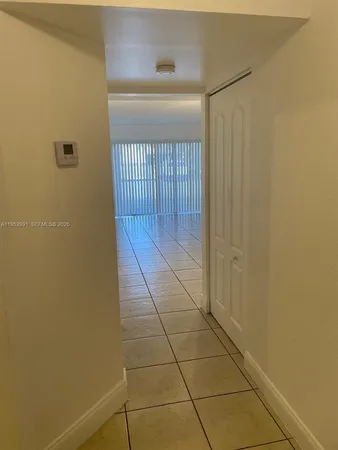 a bathroom with a shower and a sink