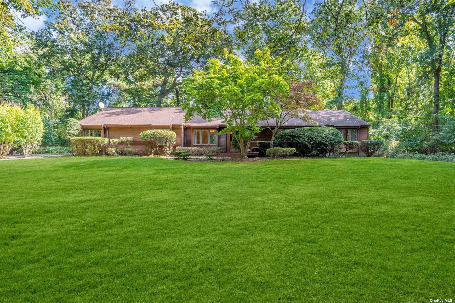 517 Long Beach Road Nissequogue, NY 11780 - Photo 1 of 1 a view of a house with a yard and sitting area