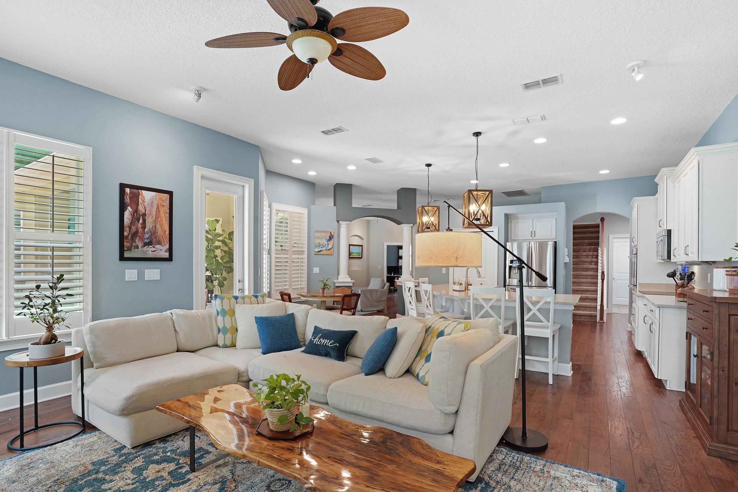 1308 Acorn Ridge Court St. Augustine, FL 32092 - Photo 15 of 47 a living room with furniture kitchen view and a wooden floor