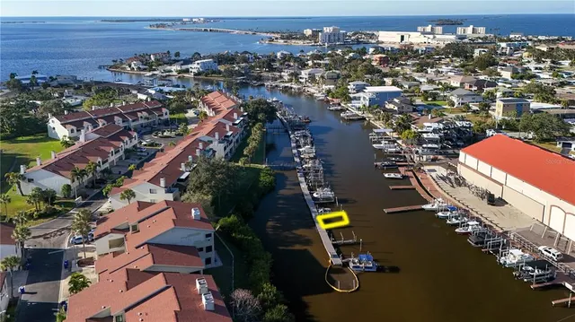 an aerial view of multiple houses with a yard