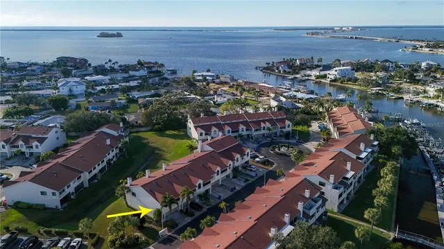 front view of house with a swimming pool and outdoor seating
