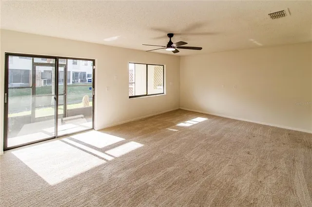 a view of a big room with carpet