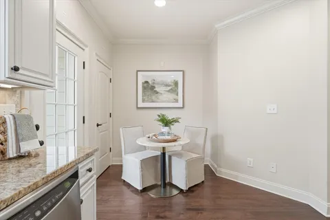 a dining room with a table and chairs
