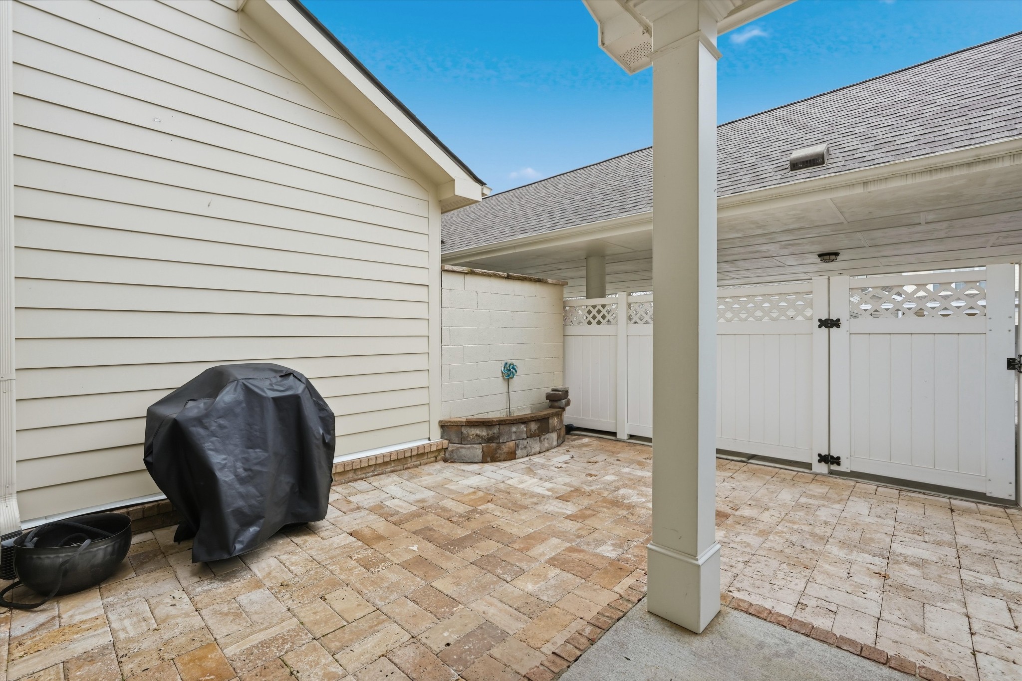 4213 Prestwick Place Spring Hill, TN 37174 - Photo 21 of 52 a view of a porch with a table and chairs and couches under an umbrella