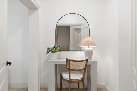 a front view of a house with table and chairs