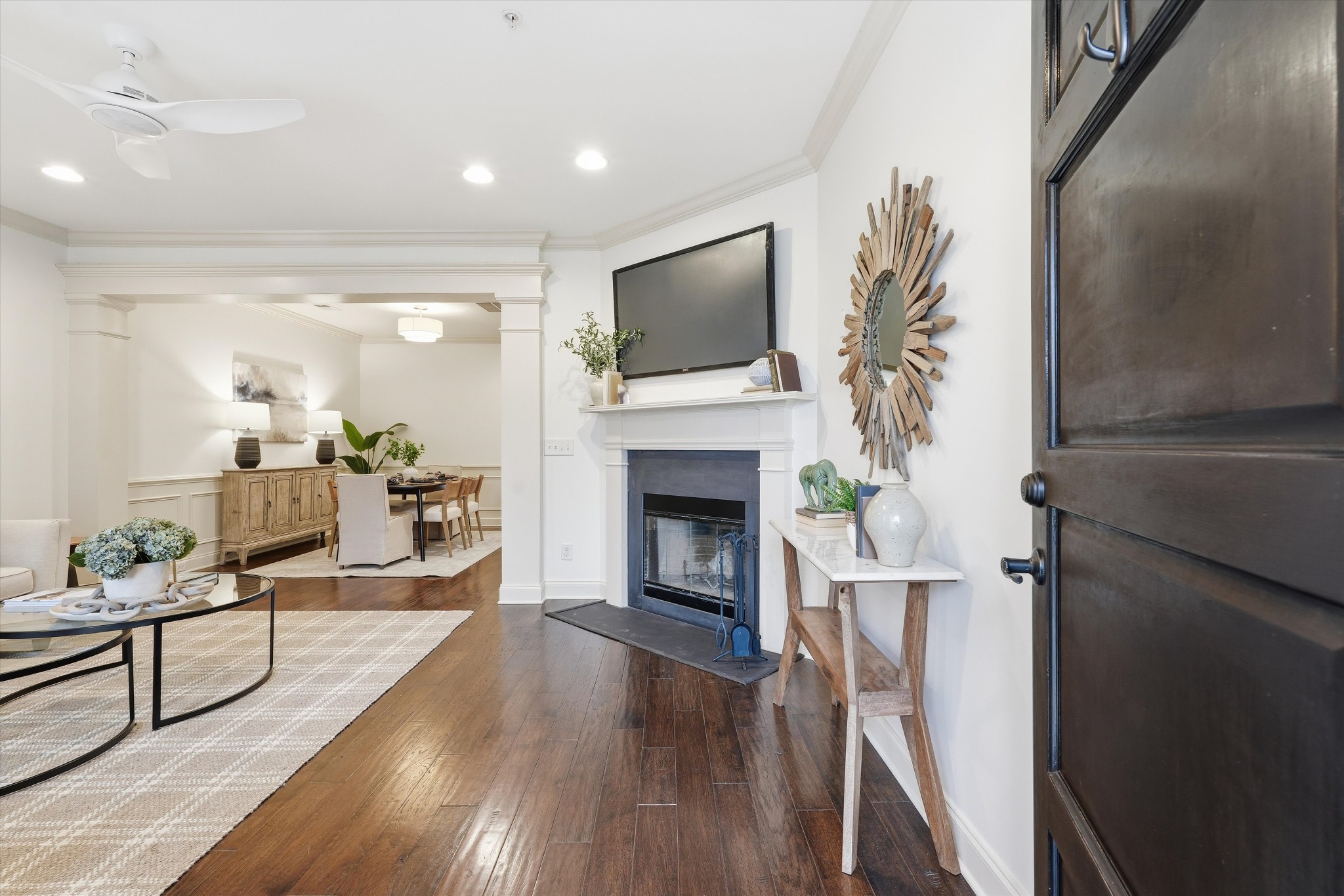 4213 Prestwick Place Spring Hill, TN 37174 - Photo 3 of 52 a living room with furniture a flat screen tv and a fireplace
