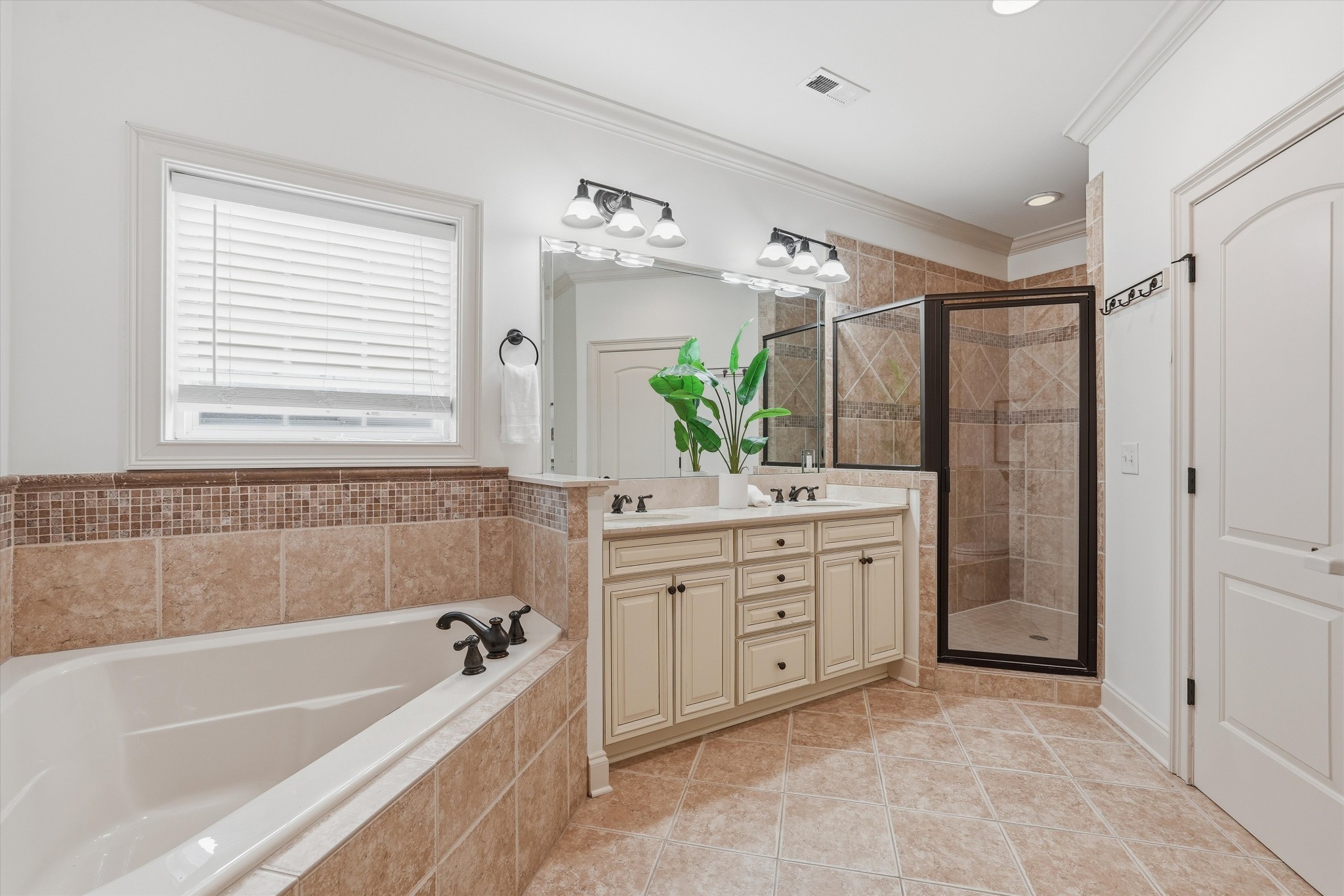 4213 Prestwick Place Spring Hill, TN 37174 - Photo 31 of 52 a bathroom with a granite countertop tub a double vanity sink and mirror
