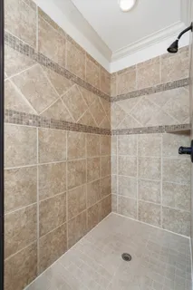 a bathroom with a bathtub a toilet and a bathtub