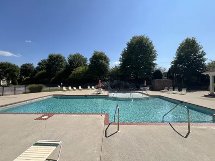 a view of a golf course with a lake view