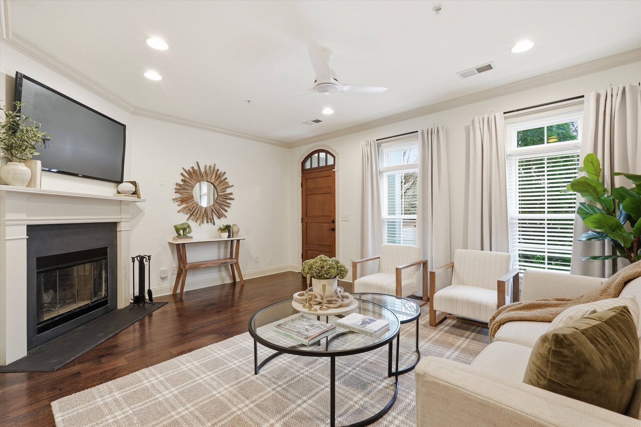 4213 Prestwick Place Spring Hill, TN 37174 - Photo 8 of 52 a living room with furniture a fireplace and a flat screen tv