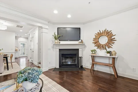 a living room with furniture fireplace and window