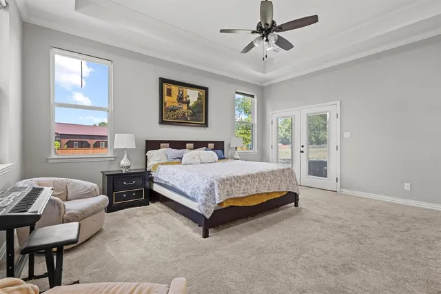 a bedroom with a bed couch and window