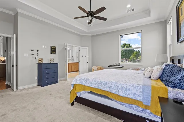 a bedroom with a bed and dresser