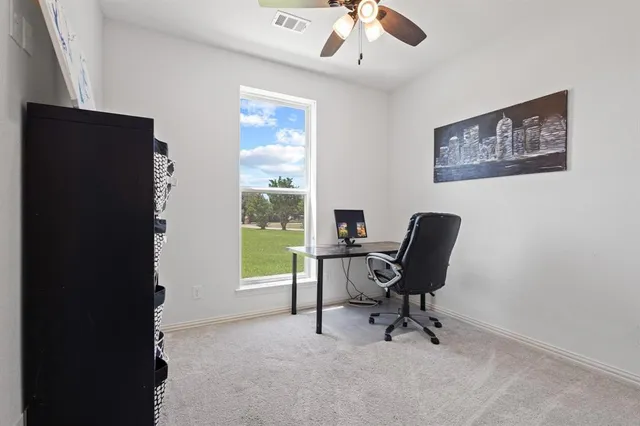 a bathroom with a toilet sink a mirror and
