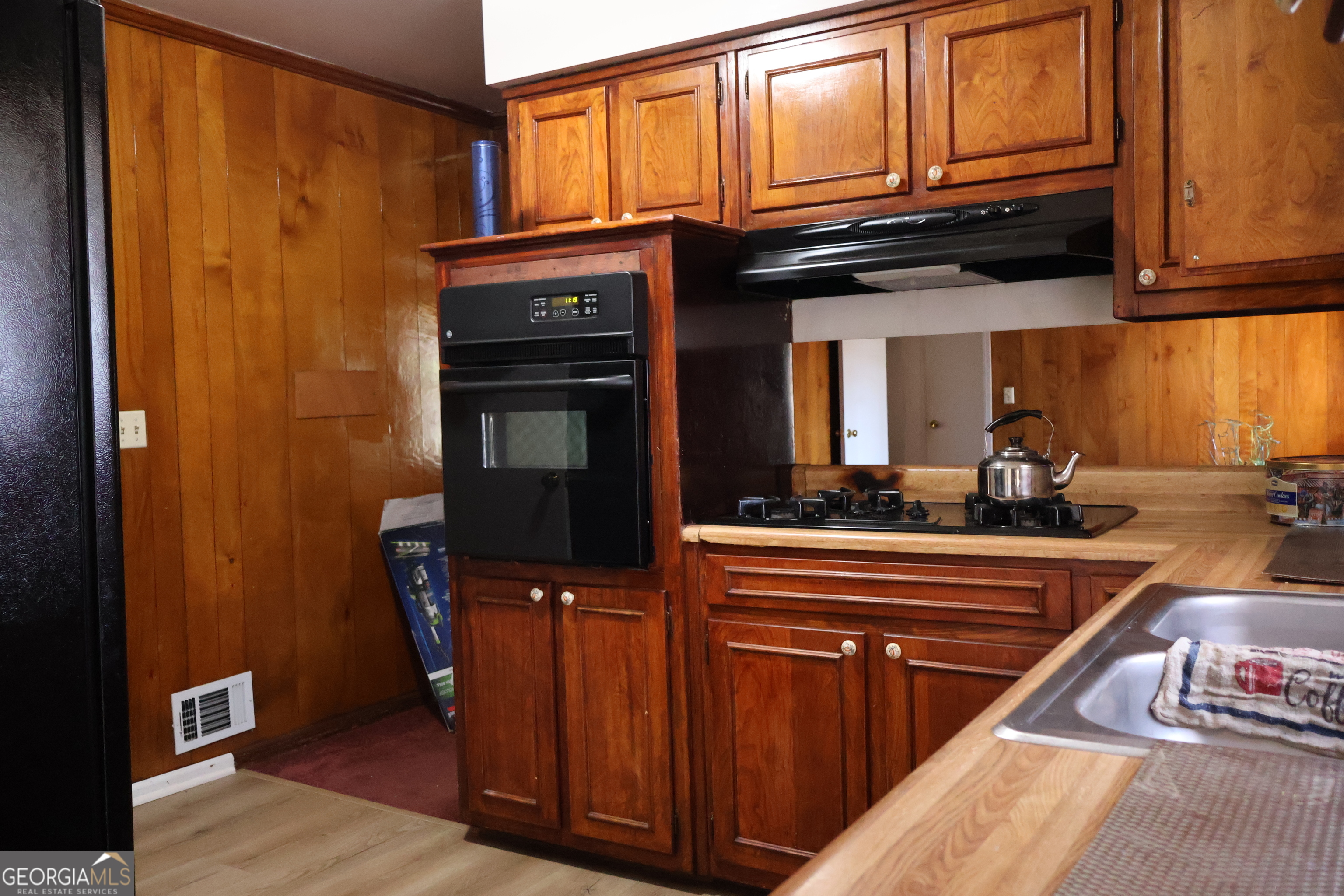 2745 Aquamist Drive Decatur, GA 30034 - Photo 7 of 9 a kitchen with stainless steel appliances granite countertop a refrigerator and a stove top oven