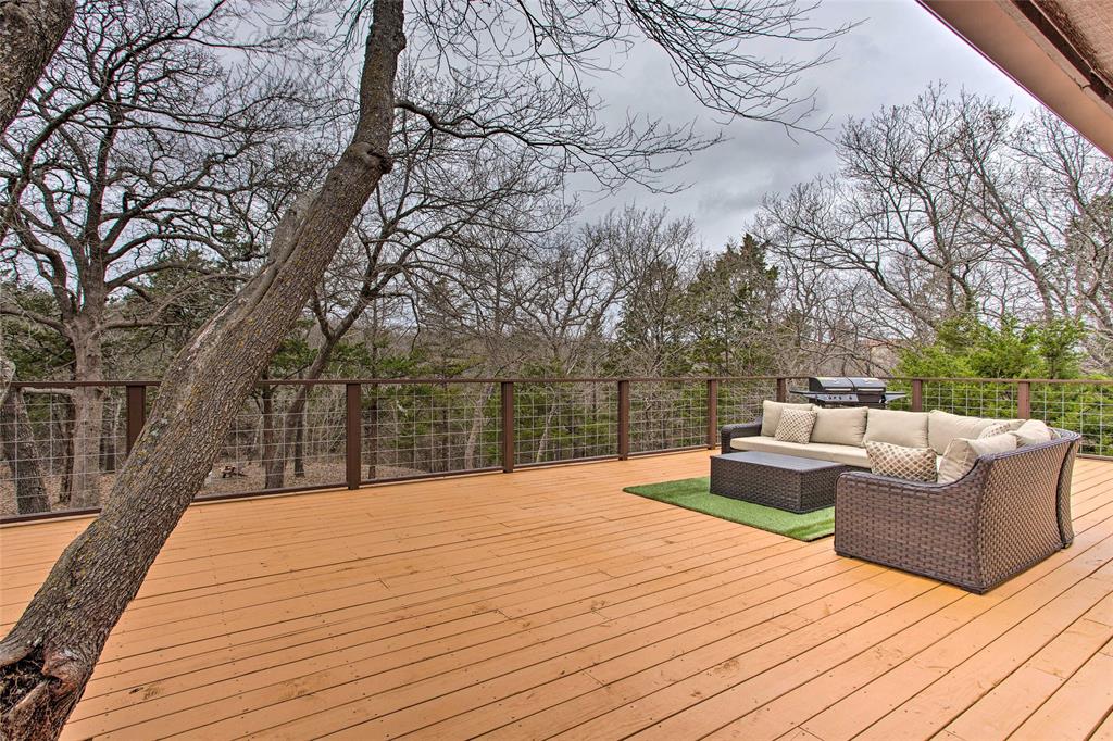 997 Tanglewood Trail Pottsboro, TX 75076 - Photo 4 of 35 a view of roof deck with couches and wooden floor